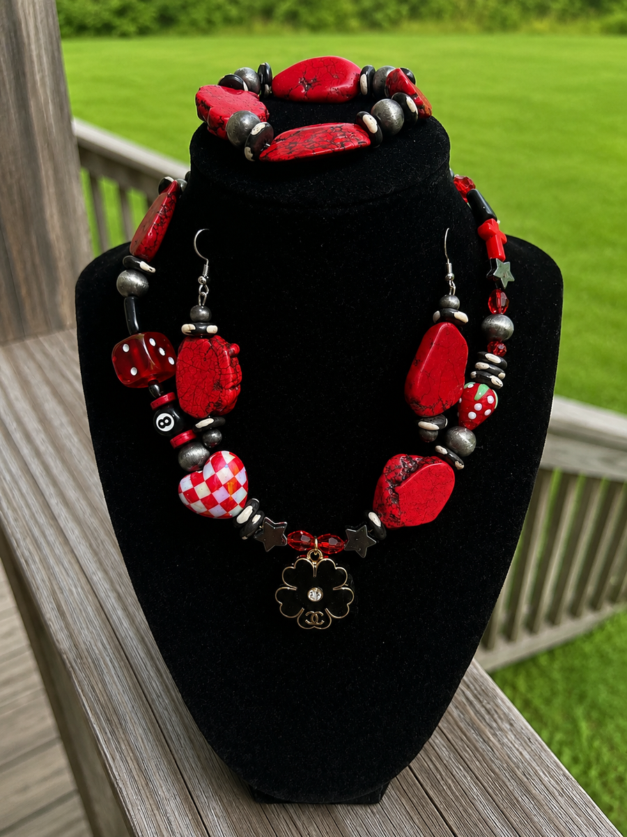 Red black and silver-tone handmade statement jewelry set with playful lucky charm details.