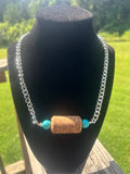 Turquoise-color mixed stone-style handmade western necklace with bow focal and silver-tone chain.