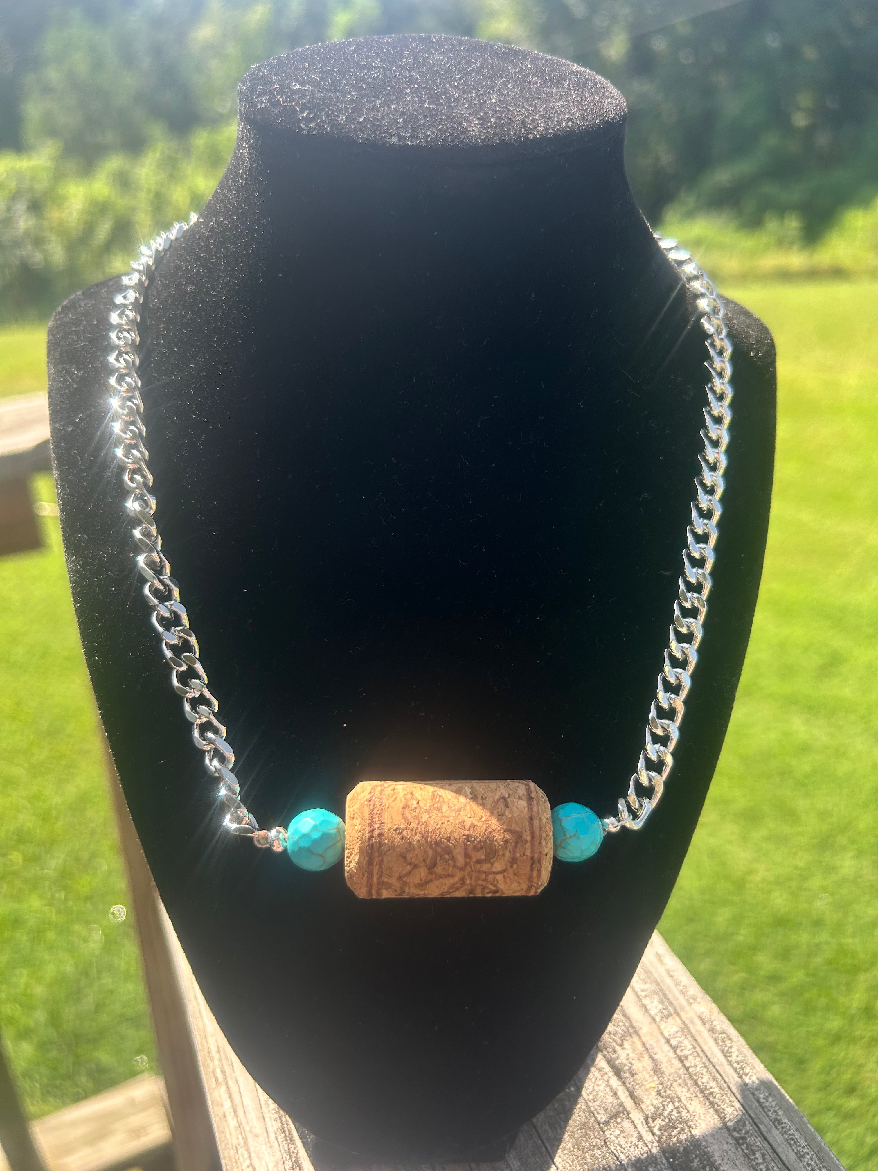 Turquoise-color mixed stone-style handmade western necklace with bow focal and silver-tone chain.
