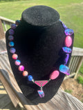 Handmade electric pink purple and blue statement necklace with mixed beads and decorative triangular focal.