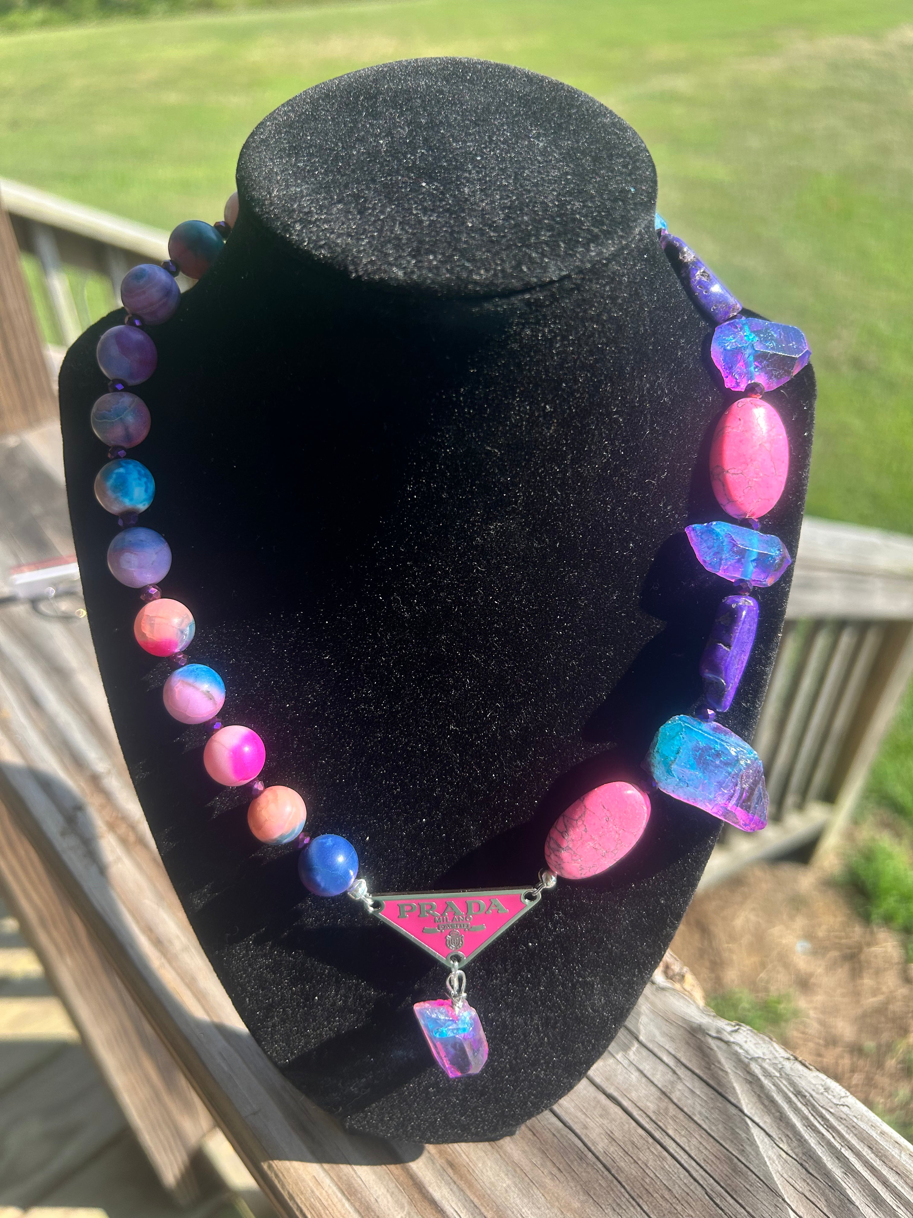 Handmade electric pink purple and blue statement necklace with mixed beads and decorative triangular focal.