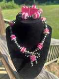 Handmade pink bow statement necklace and bracelet set with charcoal beads and silver-tone accents.