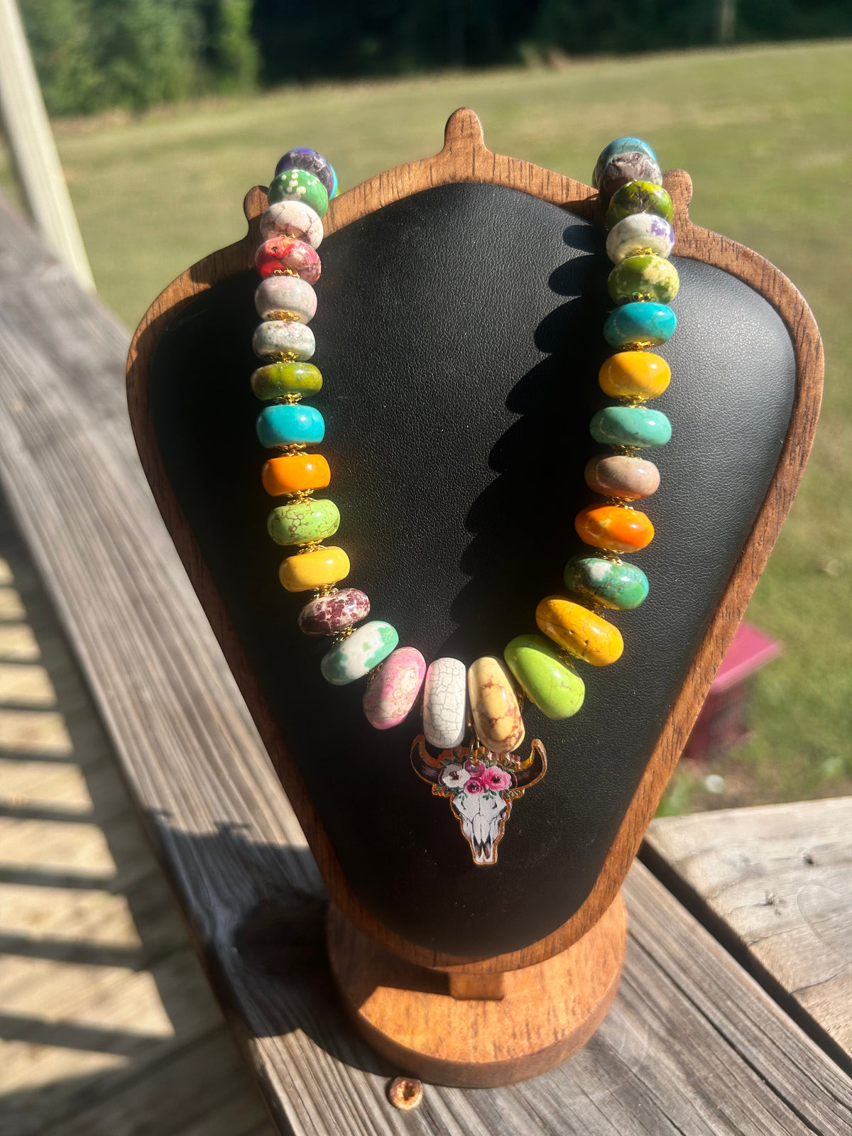 Colorful handmade western statement necklace with mixed beads and cow-skull focal.