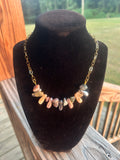 Blush pearl-style and stone-style handmade chain necklace with silver-tone details.