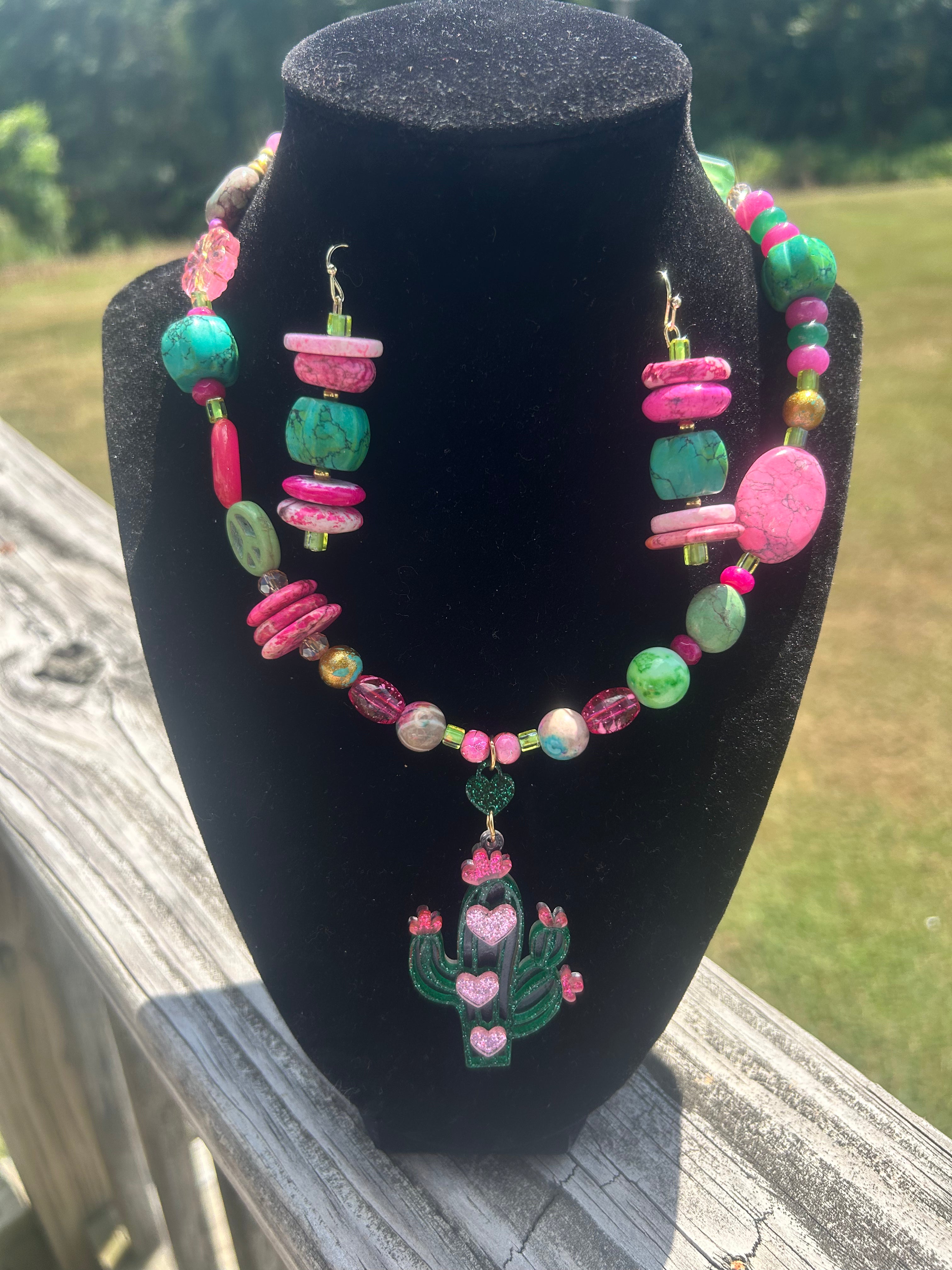 Pink and green handmade maximalist necklace and earring set with cactus-inspired focal.