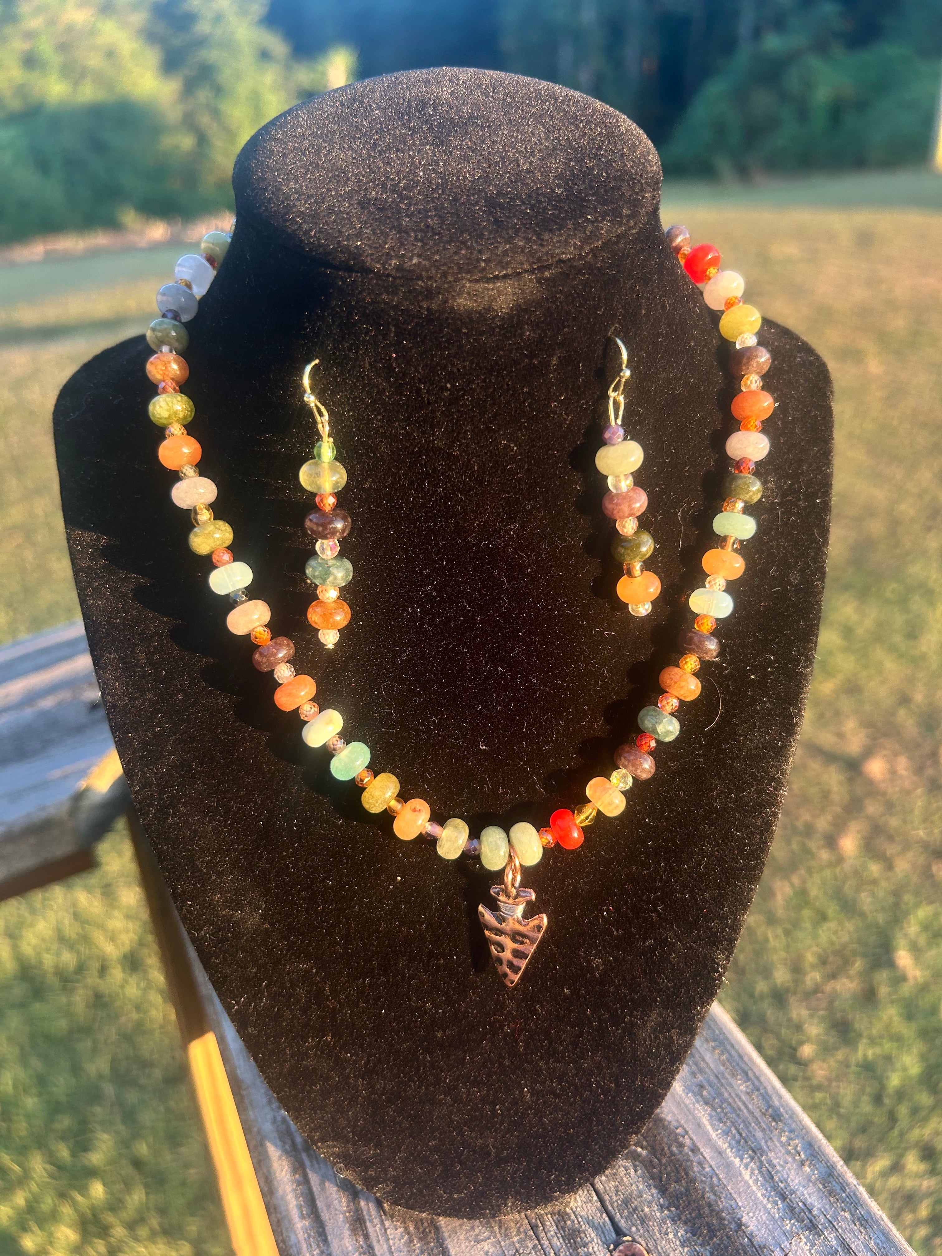 Multicolor western-boho beaded necklace and matching earrings with geometric pendant.