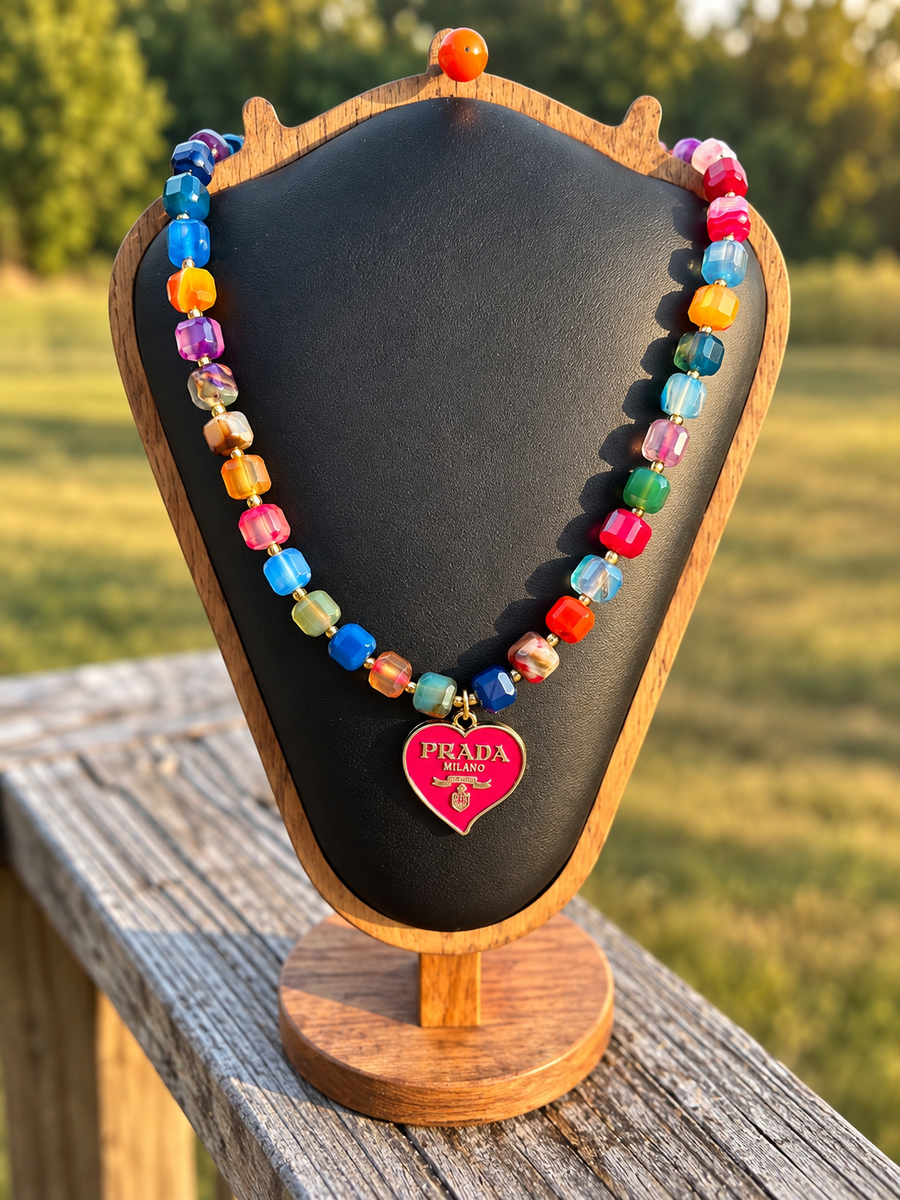 Colorful faceted bead necklace with pink heart charm